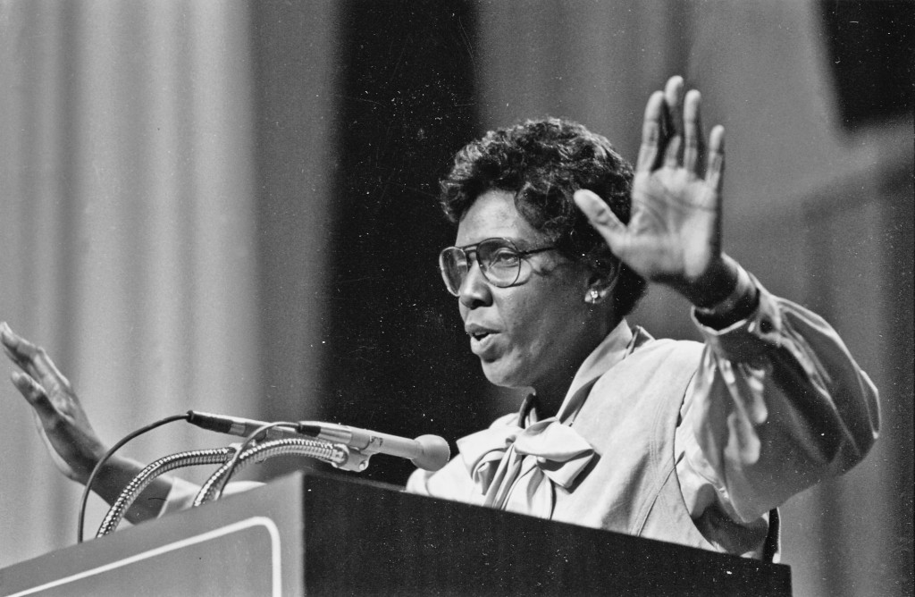 Barbara Jordan giving a speech at a podium